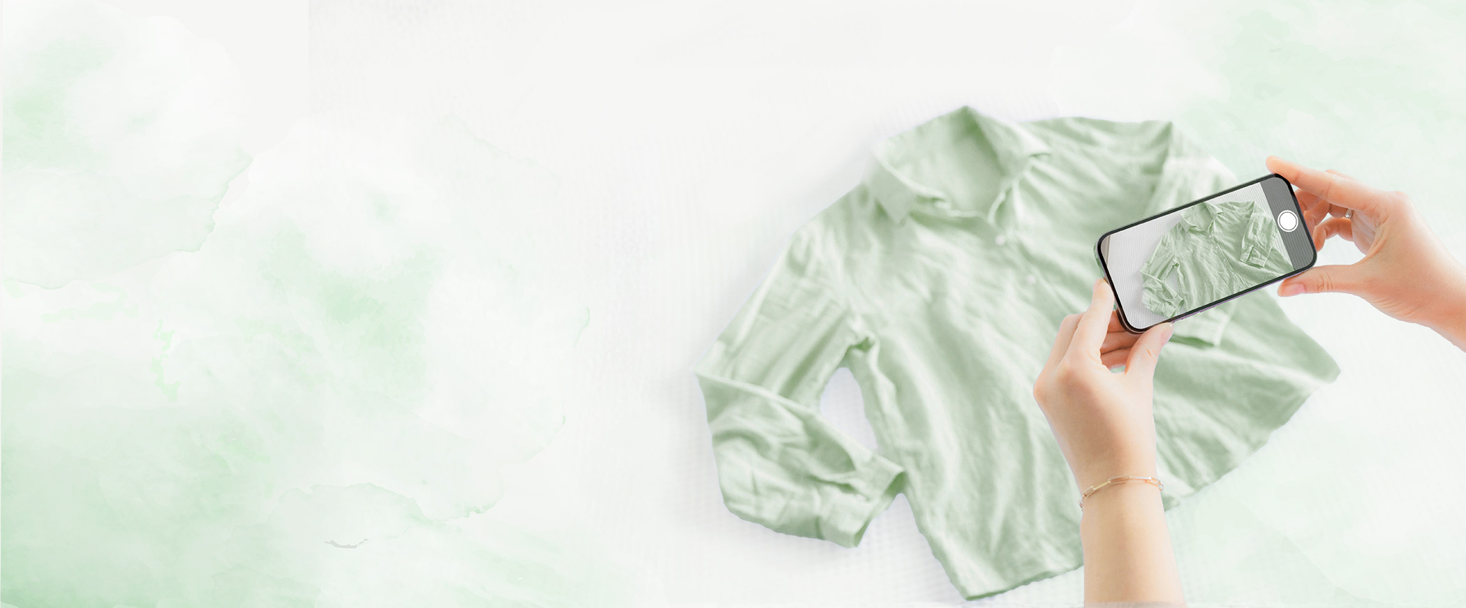 Person photographing clothing to sell online